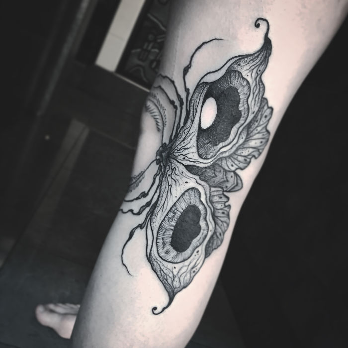 Butterfly tattoo on leg extends wings for a dynamic effect. Butterfly tattoo on leg extends wings for a dynamic effect.