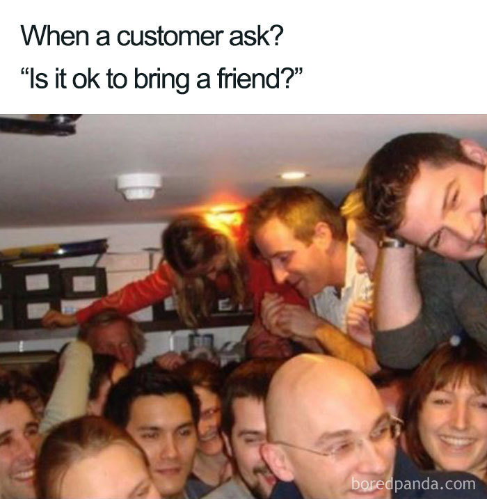Packed room humorously depicts tattoo meme about customers bringing friends.