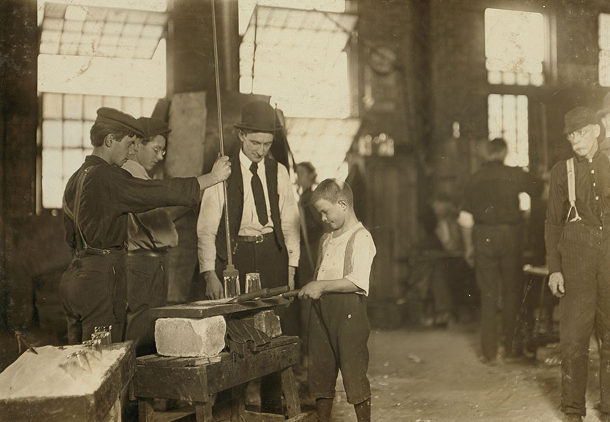 "Teaching The Young Idea." The Boss (Who Began At 10 Years Of Age, And Has Been At It For 30 Years) Showing A Beginner (Who Is Apparently 9 Or 10) See 169. Location: Morgantown, West Virginia