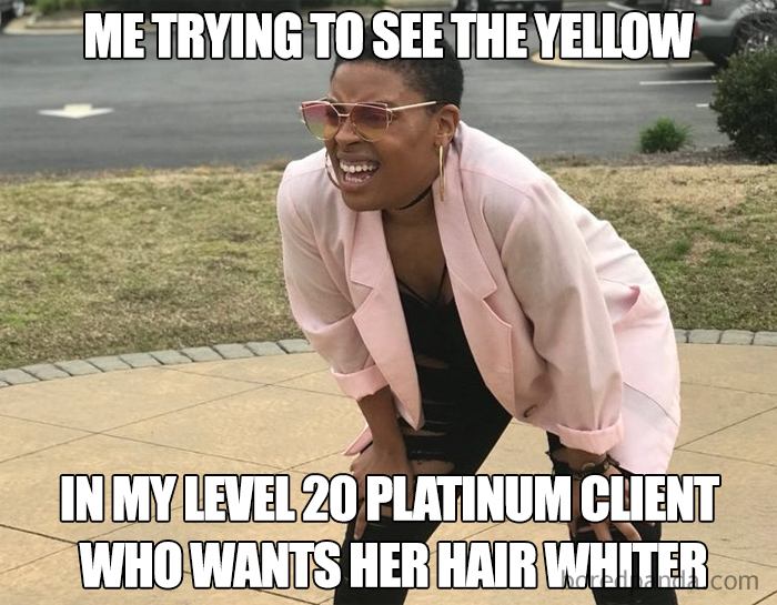 Person squinting with hands on knees, wearing sunglasses and a pink jacket, with a humorous meme about hairstylists.