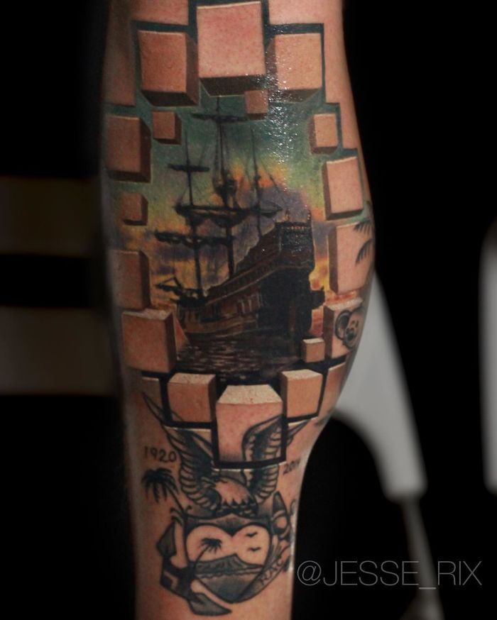 3D tattoo of a ship with a geometric cube design on a person's leg.