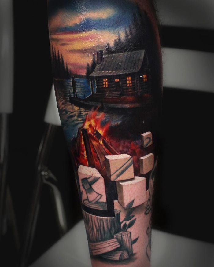 3D tattoo of a lakeside cabin and campfire, featuring realistic details and optical illusions.