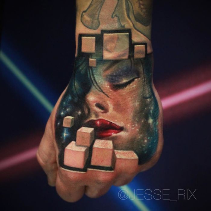 3D tattoo of a woman's face with cubes on a hand, showcasing vibrant, lifelike artistry.