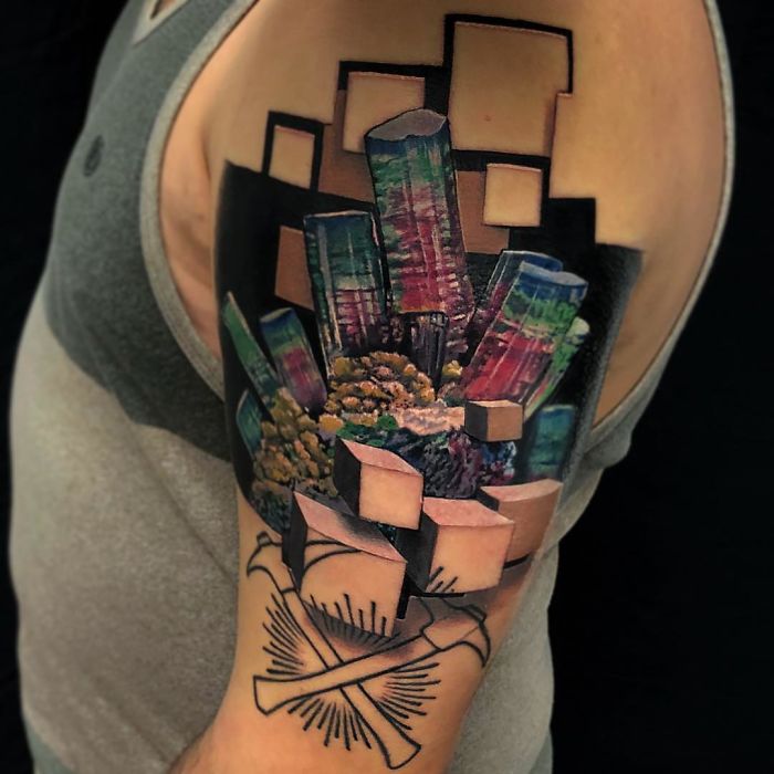 3D tattoo on arm with colorful geometric shapes, creating an amazing optical illusion.