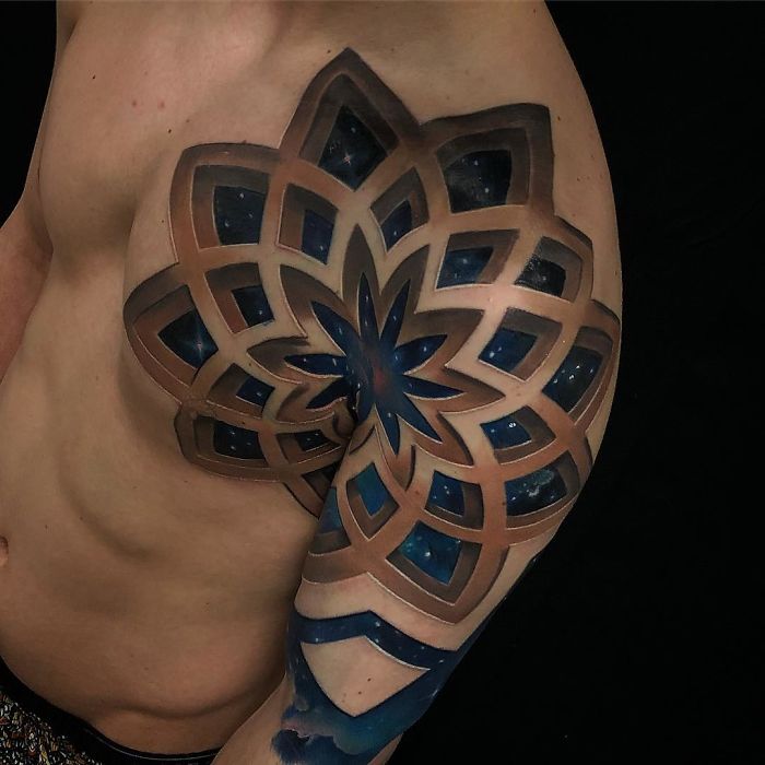 3D tattoo design on a man's arm, featuring intricate geometric patterns with a starry effect.