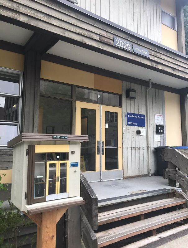 A Mini Library Modeled After The Building Behind It