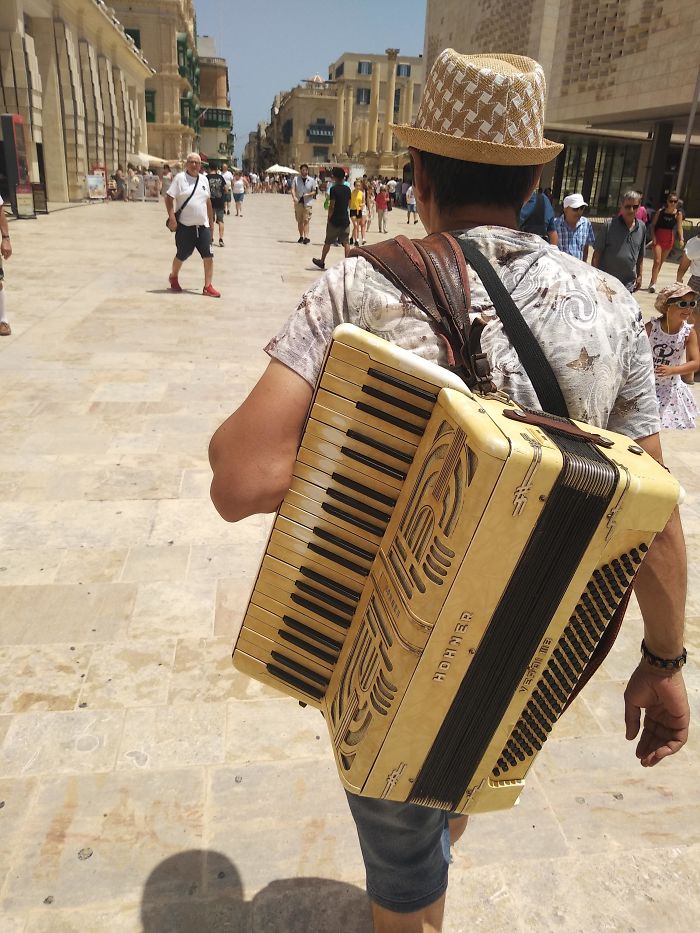 A Busker In Malta. You Can See The Notes He Plays The Most