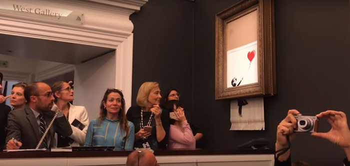 Banksy Artwork Shredded Itself Seconds After Being Sold For More Than 1 Million Dollars Banksy Artwork Shredded Itself Seconds After Being Sold For More Than 1 Million Dollars