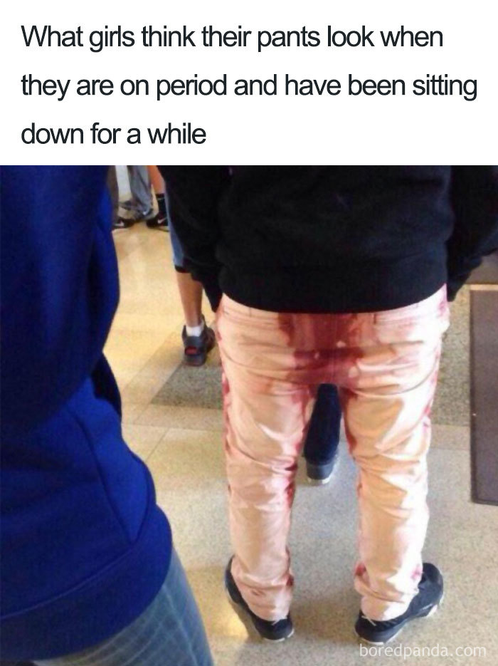Person wearing stained pants, period meme humor, standing in a public space, highlighting period anxiety.