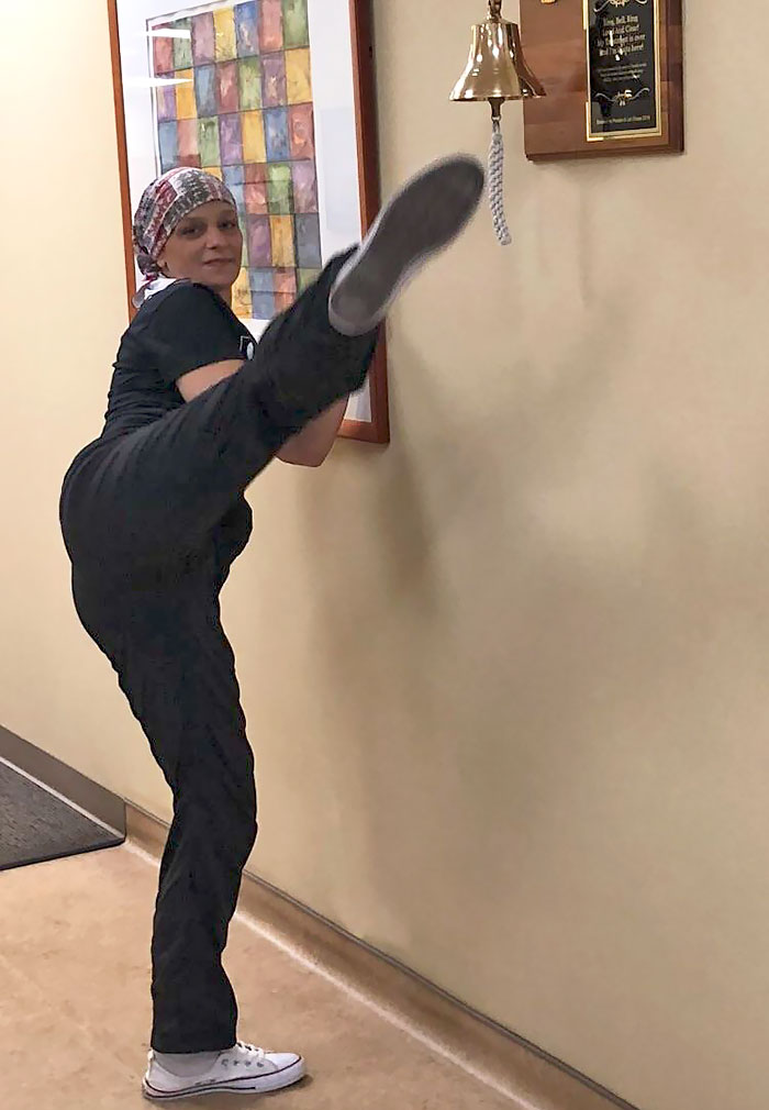 My Mom Roundhouse Kicking The Celebration Bell At Her Last Chemo Session. She's 100% My Hero