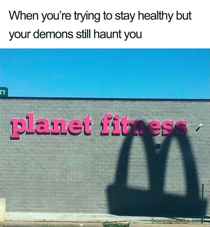 Shadow of fast food arches on Planet Fitness wall, embodying a hilarious food meme.