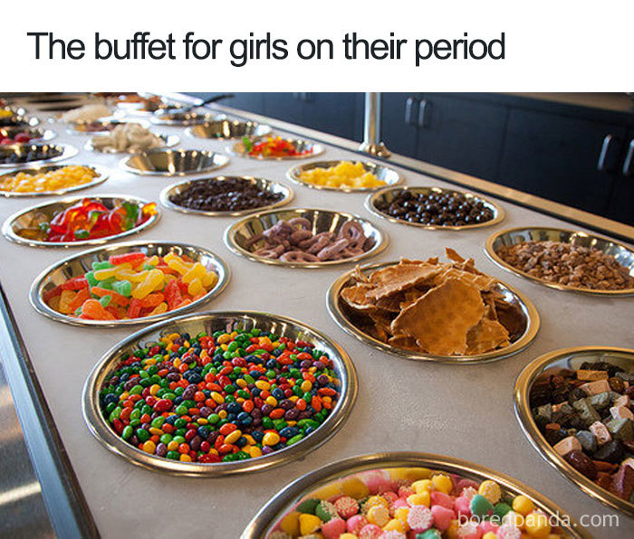 Buffet of snacks and sweets, humorously labeled for periods.