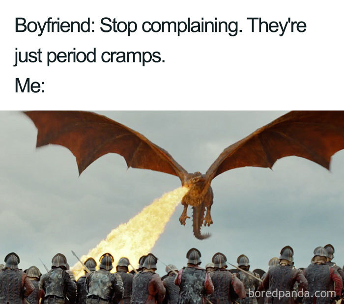 Dragon breathing fire at soldiers, illustrating a "when she's on her period" meme with humor.
