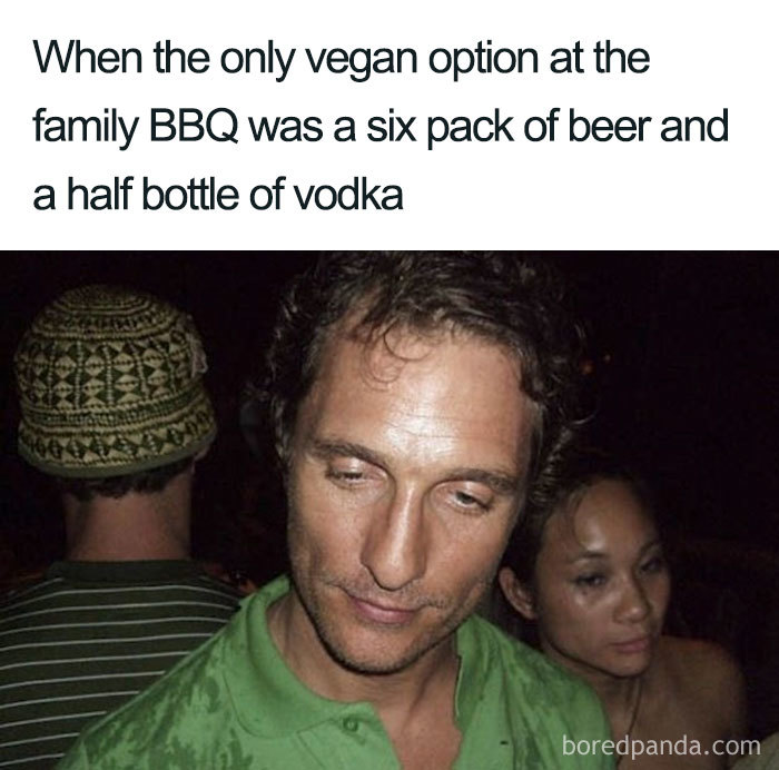 A man looking down, captioned about vegan options being just beer and vodka at a family BBQ; hilarious vegan meme.