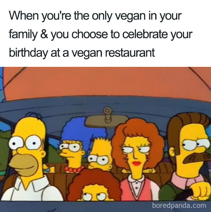 Characters in a car looking confused, captioned about celebrating at a vegan restaurant. Vegan memes humor.