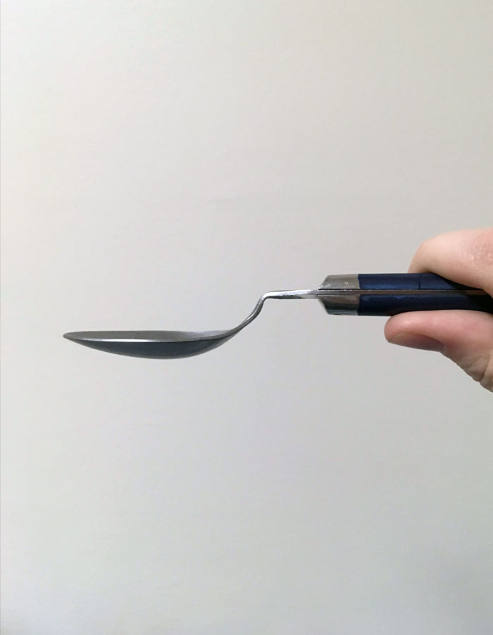 Unnatural Spoon Angle From Years Of Being Too Eager To Dig Into Really Frozen Ice Cream
