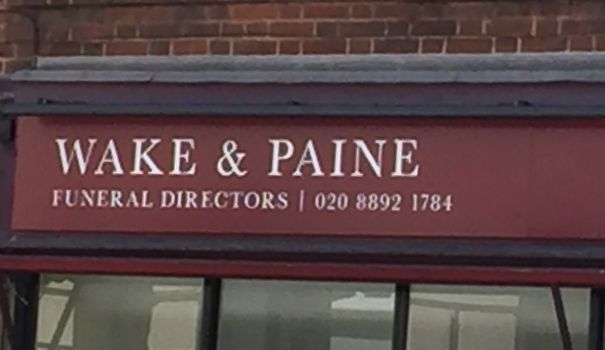 Wake & Paine funeral directors sign, a funny name suggesting they were born to do their jobs.