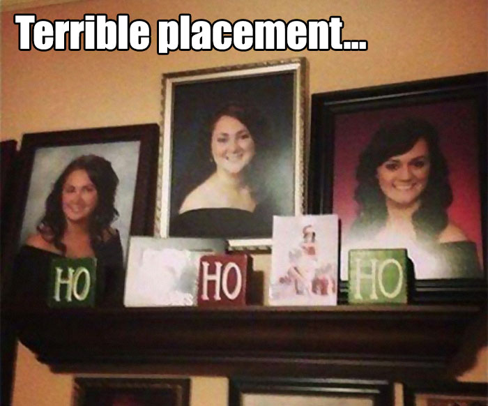 Three framed portraits on a shelf with Christmas decor, showing a comical arrangement of blocks spelling "HO HO HO" in a funny way.