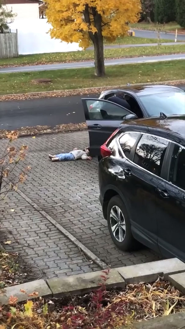 Mom Can&rsquo;t Hold Back Laughter Filming Dad Carry Their Stubborn Child Inside Like A Duffle Bag