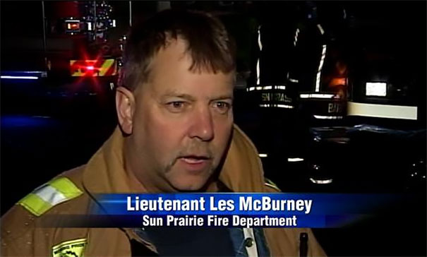 Lieutenant from Sun Prairie Fire Department in uniform, spotlighted at night, exemplifying people born to do their jobs.