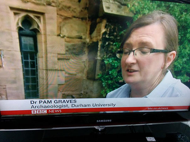 Archaeologist discussing findings on BBC News, embodying people born to do their jobs.