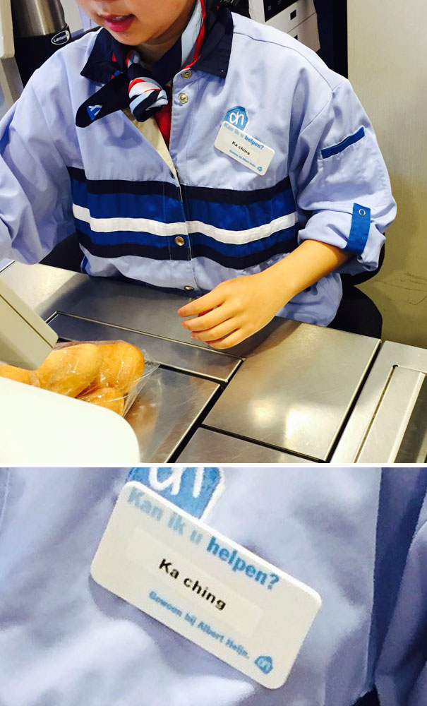 Cashier with a fitting name tag, humorously reflecting being born to do their job.