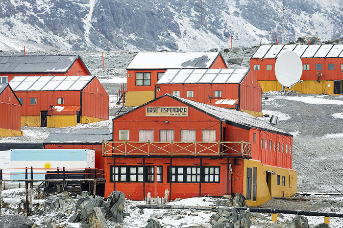 Research base buildings at Esperanza Station in Antarctica, illustrating unique and unbelievable facts about the continent.