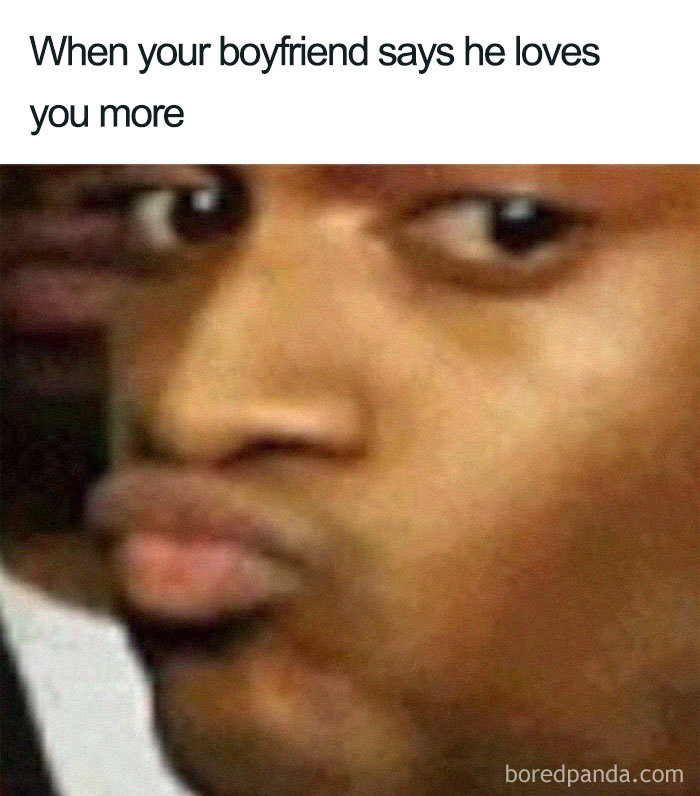 Close-up of a person making a skeptical face with the text: "When your boyfriend says he loves you more," relating to relationship memes.
