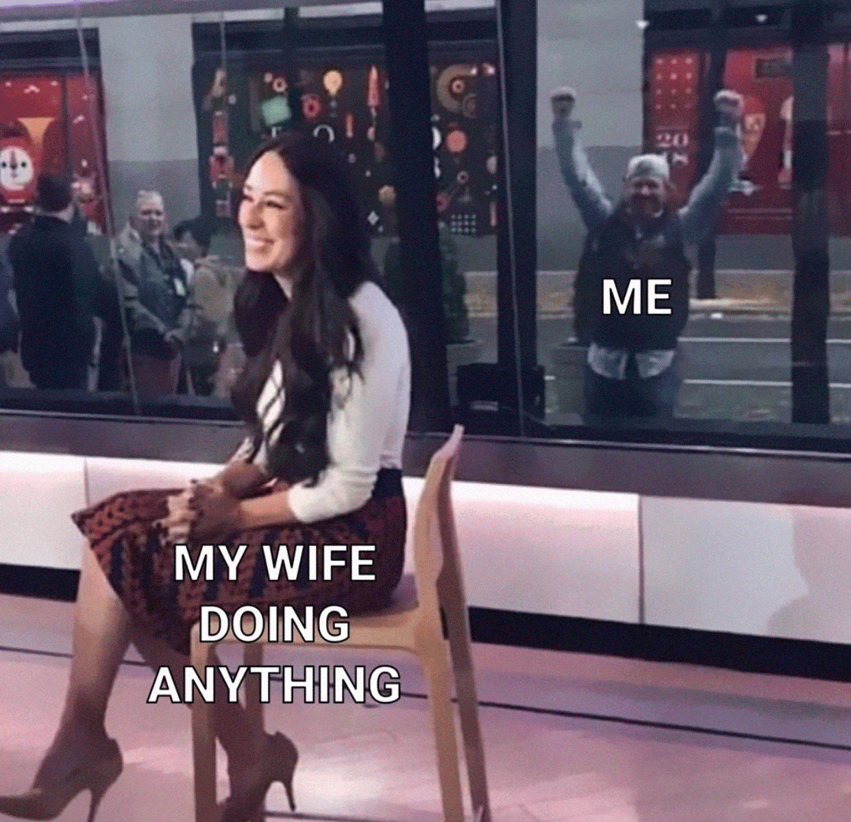 Woman sitting indoors with a man cheering outside labeled as a wholesome relationship meme.