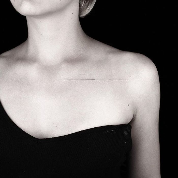 Minimalist geometric tattoo on shoulder by Turkish artist, showcasing sleek lines and elegance.