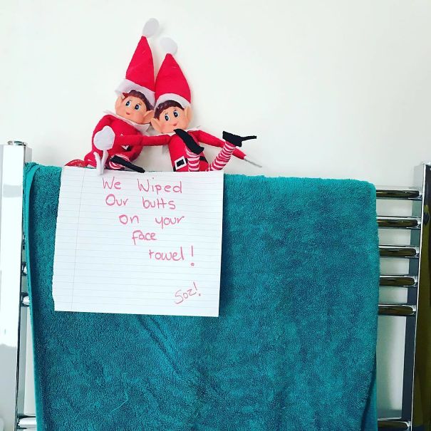 "Elf On The Shelf idea with two elves sitting on a towel rack, leaving a note saying, 'We wiped our butts on your face towel! Soz!'"