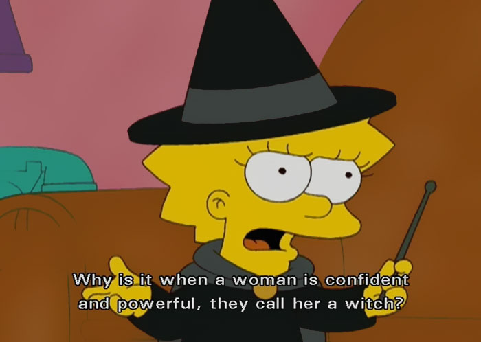 Cartoon character dressed as a witch, questioning stereotypes tied to confident women; feminist meme humor highlights truth.