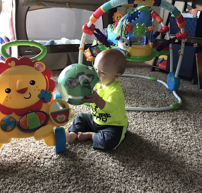 My Son Playing With His Helmet