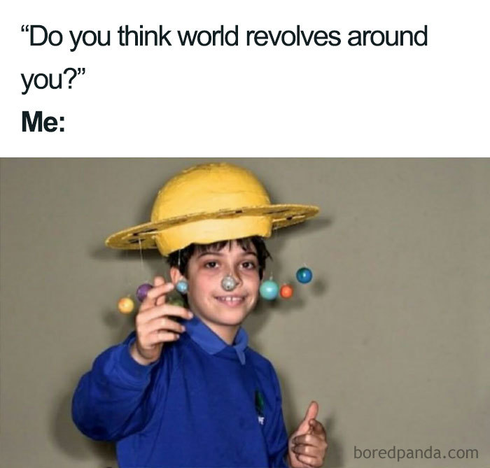 Child wearing a solar system hat for a funny space meme with planets orbiting around their head.