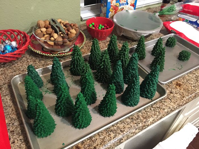 This Family Takes Gingerbread House Building To The Next Level, Destroys Them With An Axe Or Baseball Bat