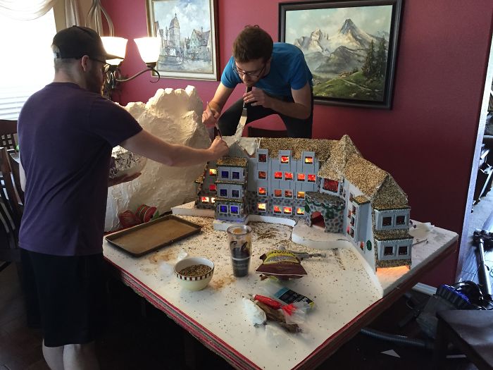 This Family Takes Gingerbread House Building To The Next Level, Destroys Them With An Axe Or Baseball Bat