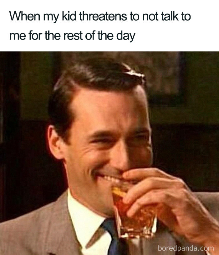 Man smirking while holding a drink, captioned with a humorous mom meme about kids giving silent treatment.