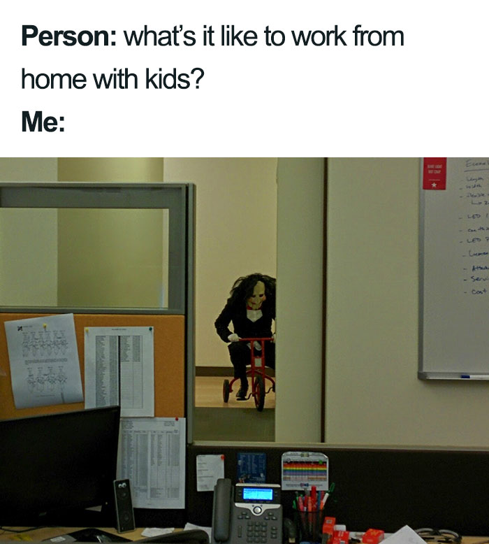 Office desk with a spooky character on a tricycle in the background, humorously depicting mom memes about working from home.