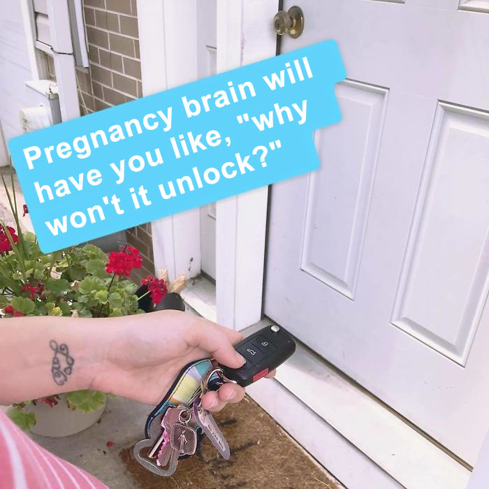 Pregnancy meme with a hand holding car keys trying to unlock a house door, highlighting forgetfulness humor.