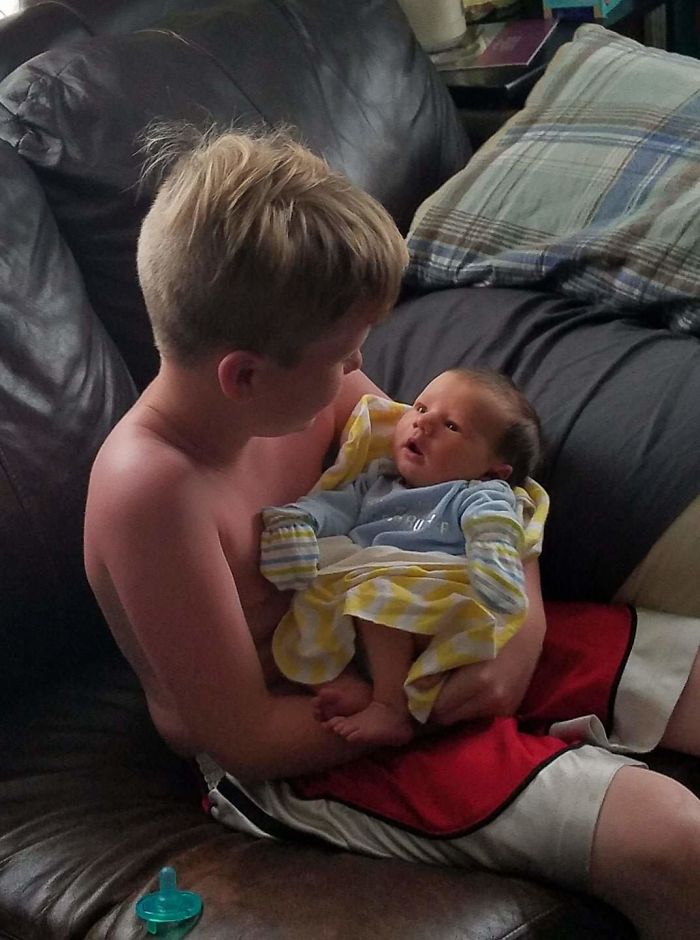 3 Days After My Youngest Son Was Born I Went To The Bathroom, He Got Fussy, And My Oldest Picked Him Up. Baby Just Sat There And Stared. Aww