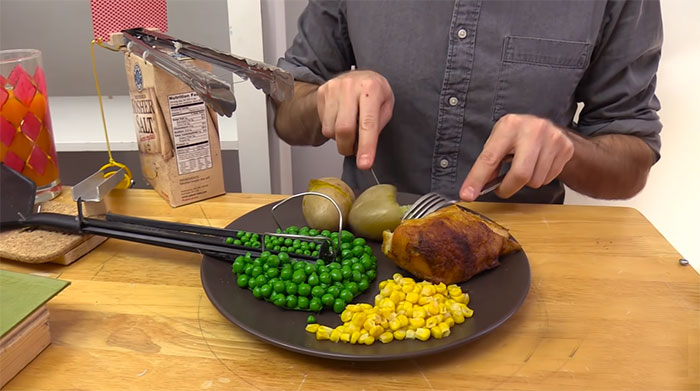 Guy Builds And Films A Chain-Reaction Machine In His Dining Room And You Won't Believe It's Not Edited