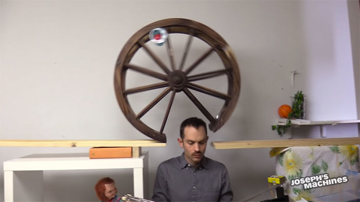 Guy Builds And Films A Chain-Reaction Machine In His Dining Room And You Won't Believe It's Not Edited