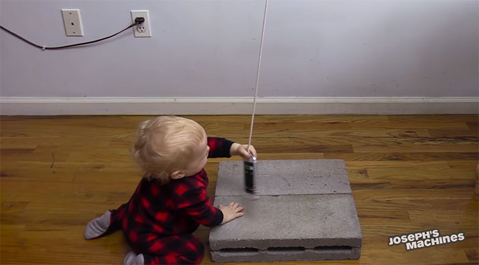 Guy Builds And Films A Chain-Reaction Machine In His Dining Room And You Won't Believe It's Not Edited