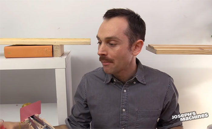 Guy Builds And Films A Chain-Reaction Machine In His Dining Room And You Won't Believe It's Not Edited