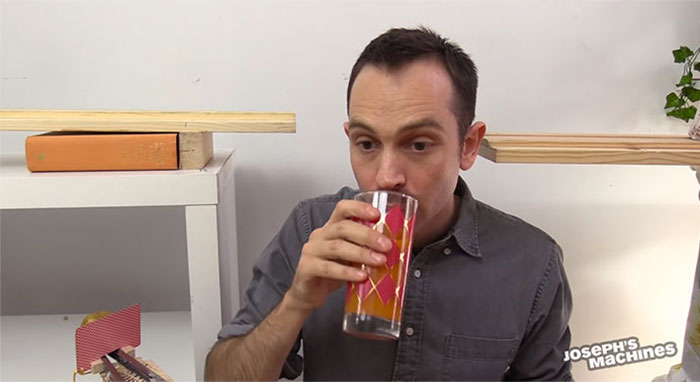 Guy Builds And Films A Chain-Reaction Machine In His Dining Room And You Won't Believe It's Not Edited