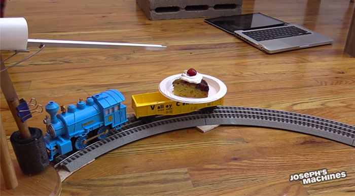 Guy Builds And Films A Chain-Reaction Machine In His Dining Room And You Won't Believe It's Not Edited