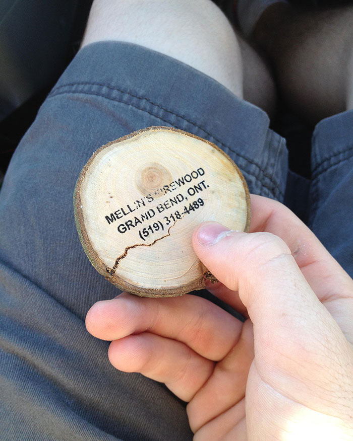 A Firewood Store Near My Campsite Uses Pieces Of Wood As Business Cards