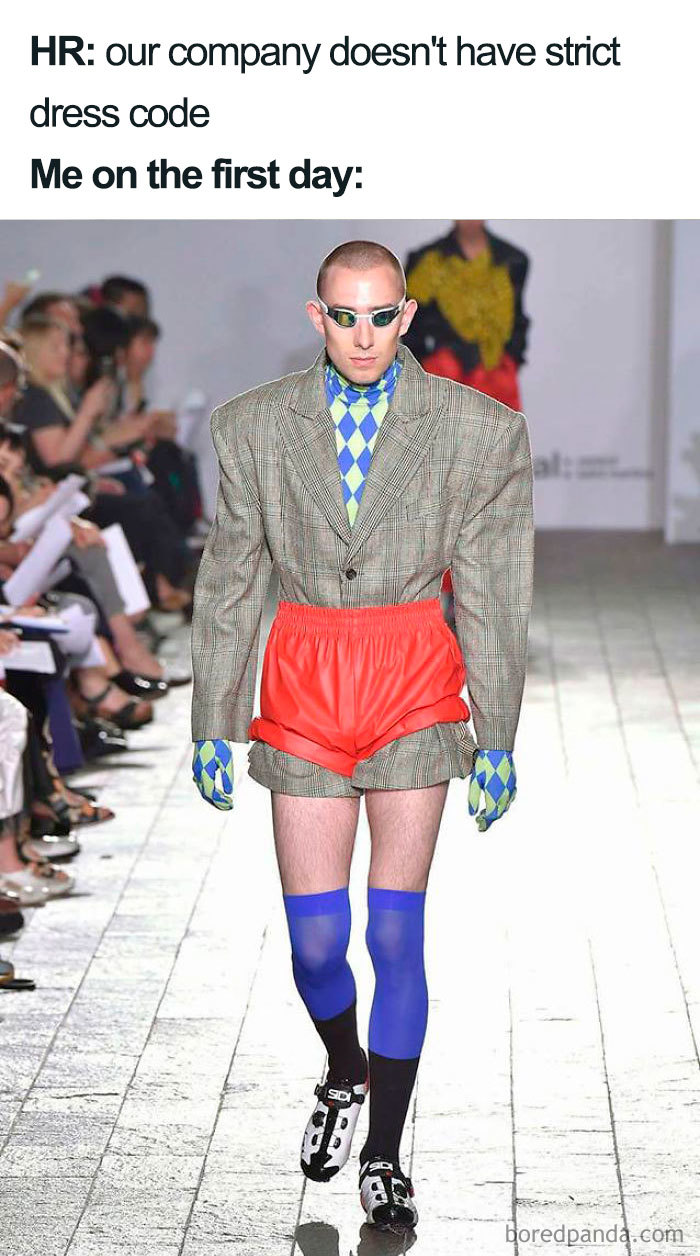 Fashion disaster outfit with plaid jacket, bright shorts, and checkered gloves on runway.
