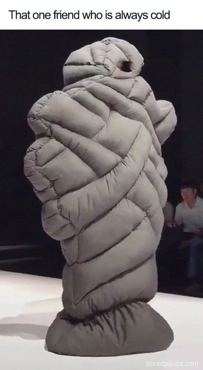 Fashion disaster meme of a person humorously wrapped in a padded outfit on a runway.