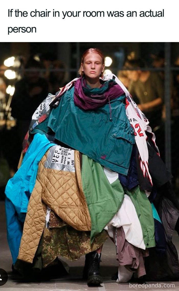 Fashion disasters: person draped in multiple layers of mismatched clothing on runway, resembling a pile of clothes.